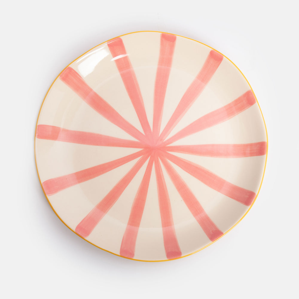 hand made and painted ceramic dinner plate with yellow underside and pink striped inner