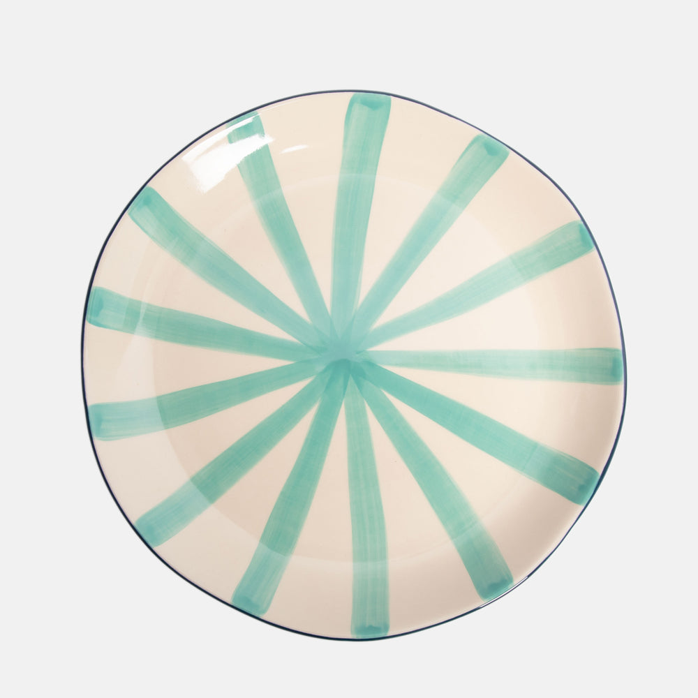 hand made and painted ceramic plate with dark blue under and light blue sunray stripe inner