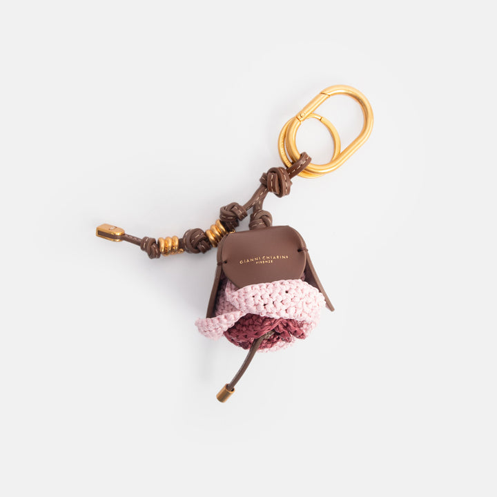pink & raspberry colour woven straw bag charm with leather knotted strap and gold hardware