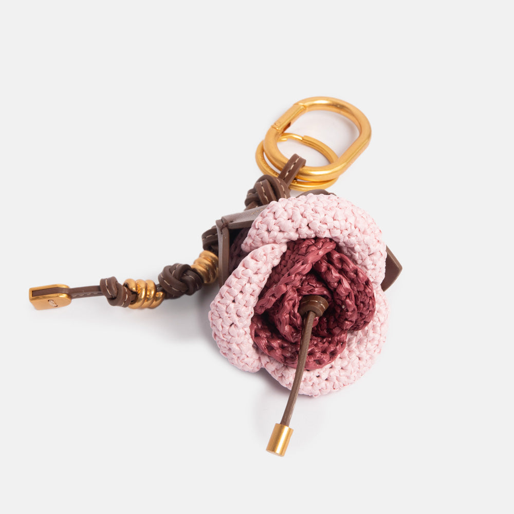 pink & raspberry colour woven straw bag charm with leather knotted strap and gold hardware