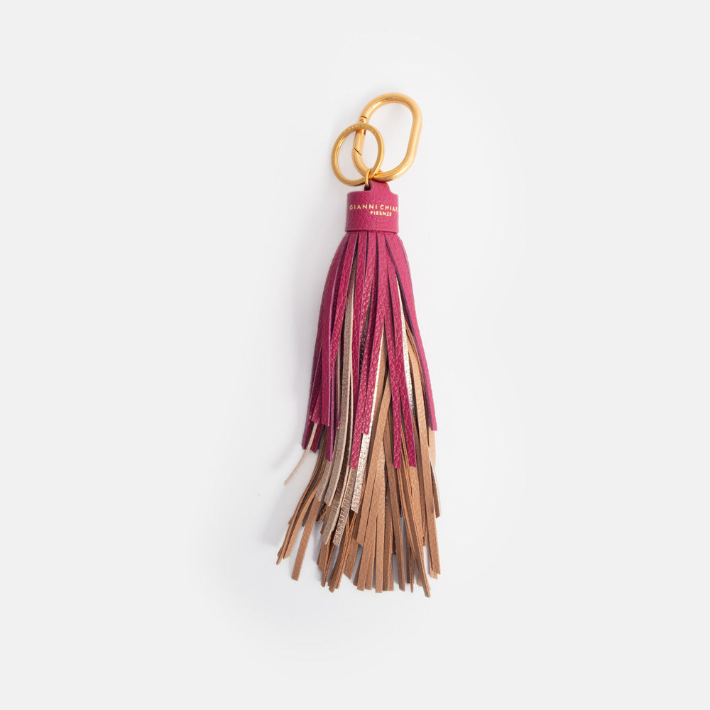 leather tasselled bag charm, or large keyring, with dark pink, gold and tan leather tassels and gold o ring and carabiner