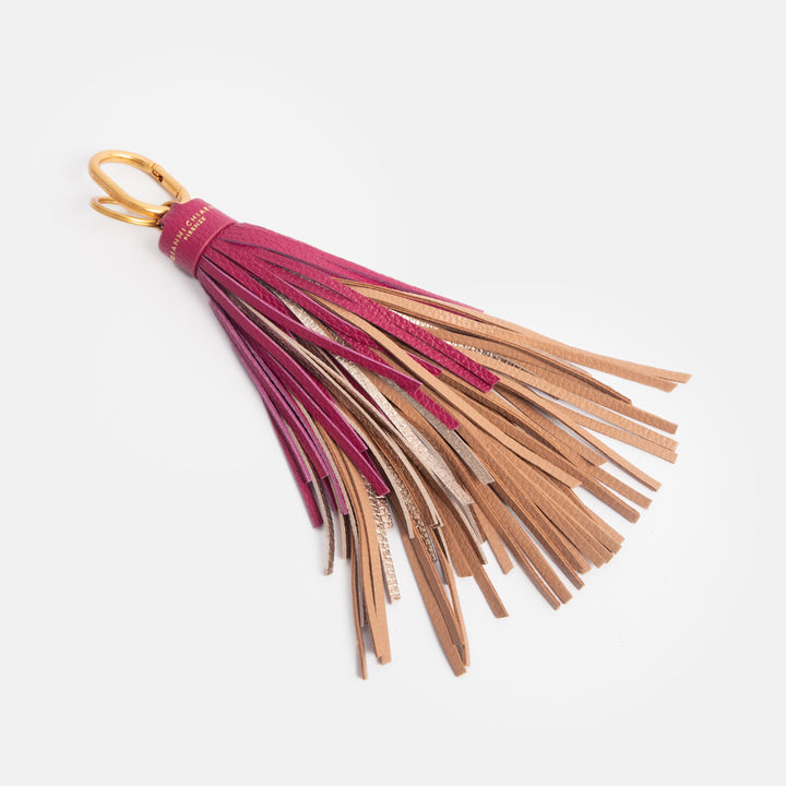 leather tasselled bag charm, or large keyring, with dark pink, gold and tan leather tassels and gold o ring and carabiner