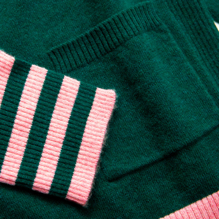 green pure cashmere crew neck jumper with pale pink waist trim and striped cuffs, made by Cocoa Cashmere