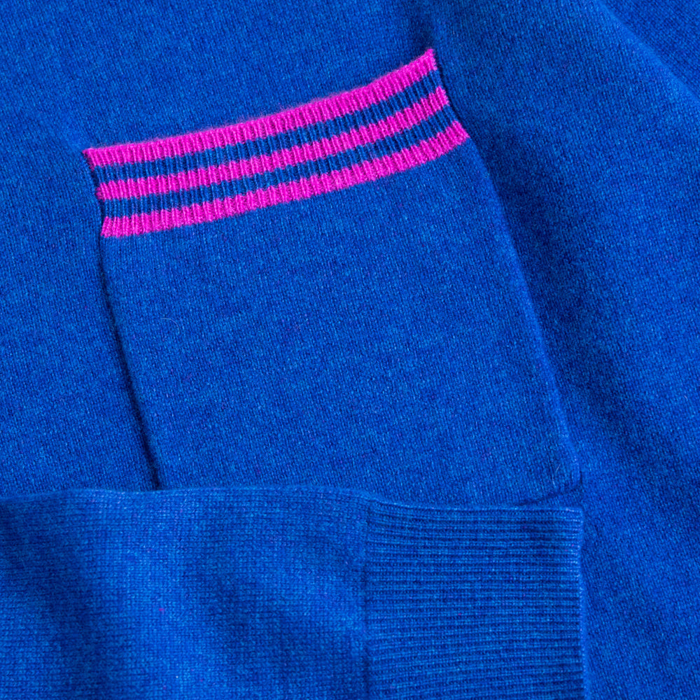 bright blue pure cashmere crew neck jumper with contrast pink stripe front pocket, made by Cocoa Cashmere