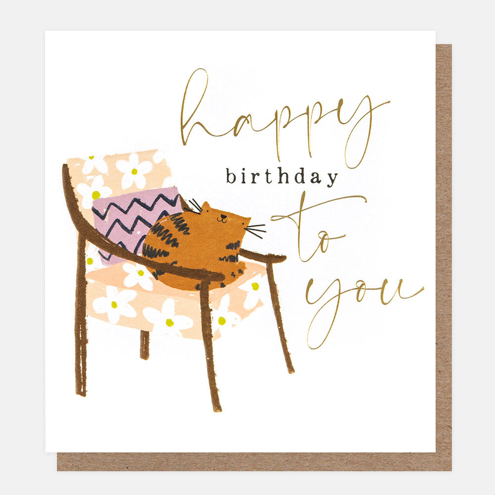 ginger cat on a floral pattern chair happy birthday to you card