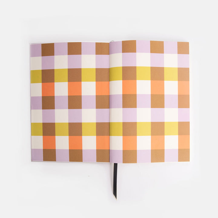 Journal inside covers with a checked design in pastel colours on a white background