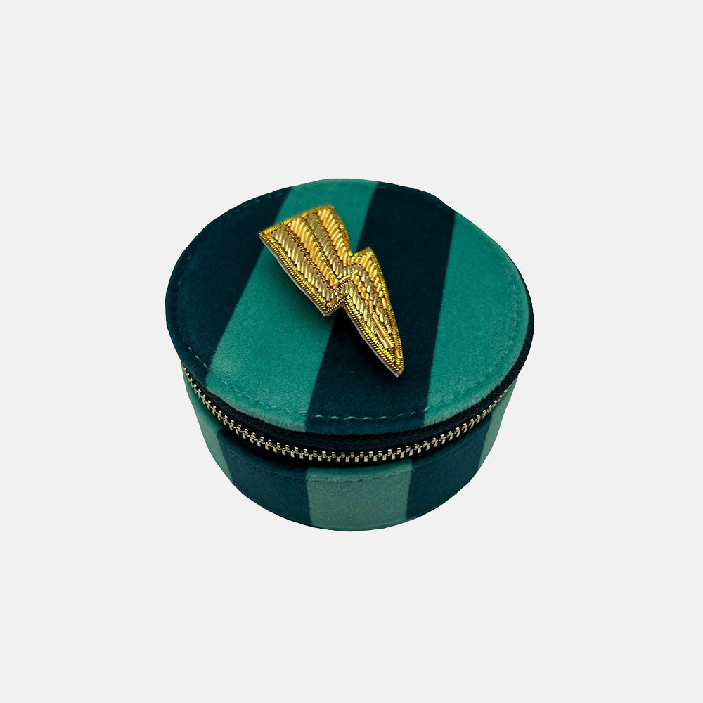 blue stripe velvet travel jewellery box with gold lightning bolt brooch 