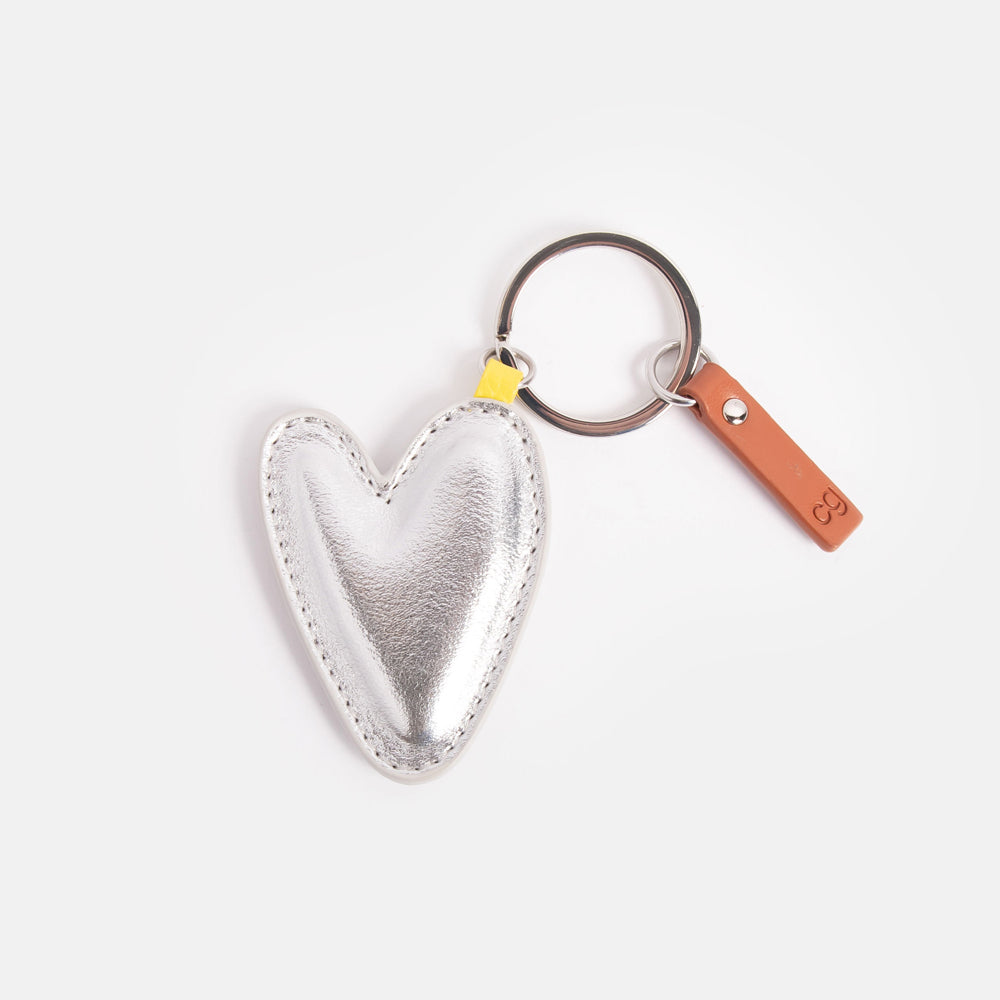 leather look PU padded heart shaped keyring in metallic silver