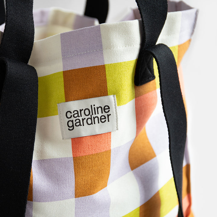 large cotton canvas tote or shopper bag in multi coloured check print with grab and shoulder straps