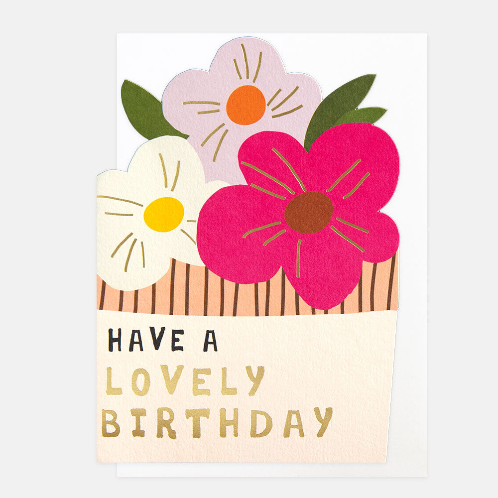 birthday card cut out in a flower pot shape featuring pink flowers and 'have a lovely birthday' message