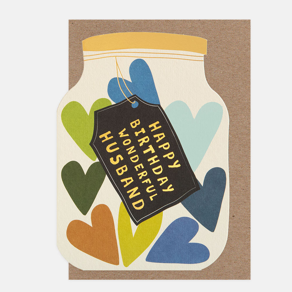 Greeting card with colorful hearts and a tag reading 'Happy Birthday Wonderful Husband' on a brown background.