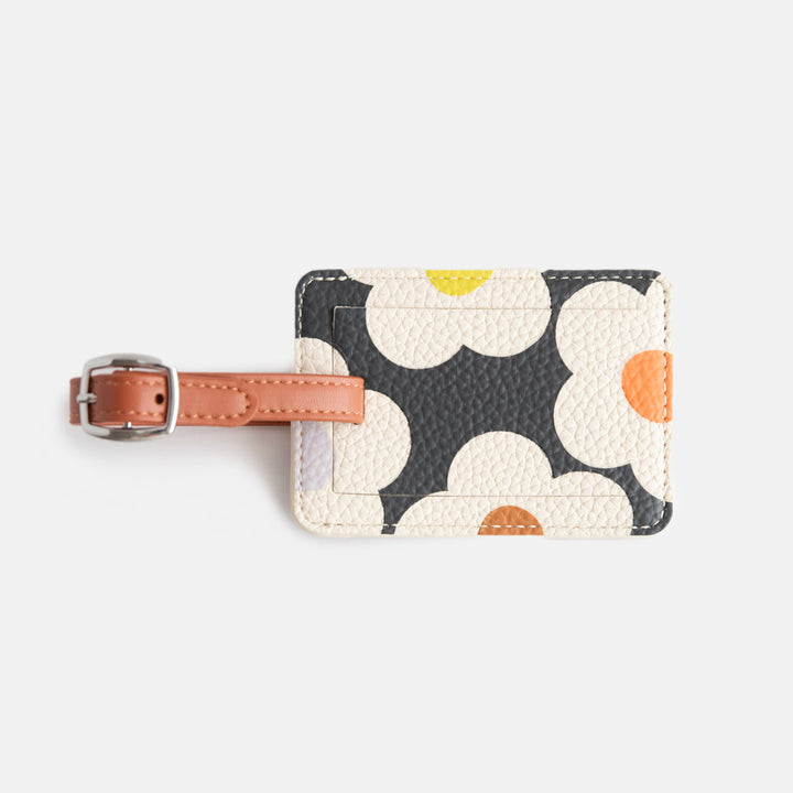 leather look PU luggage tag in multi flower charcoal print with tan buckled strap