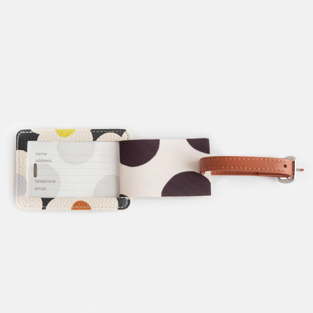 leather look PU luggage tag in multi flower charcoal print with tan buckled strap and mono spot lining