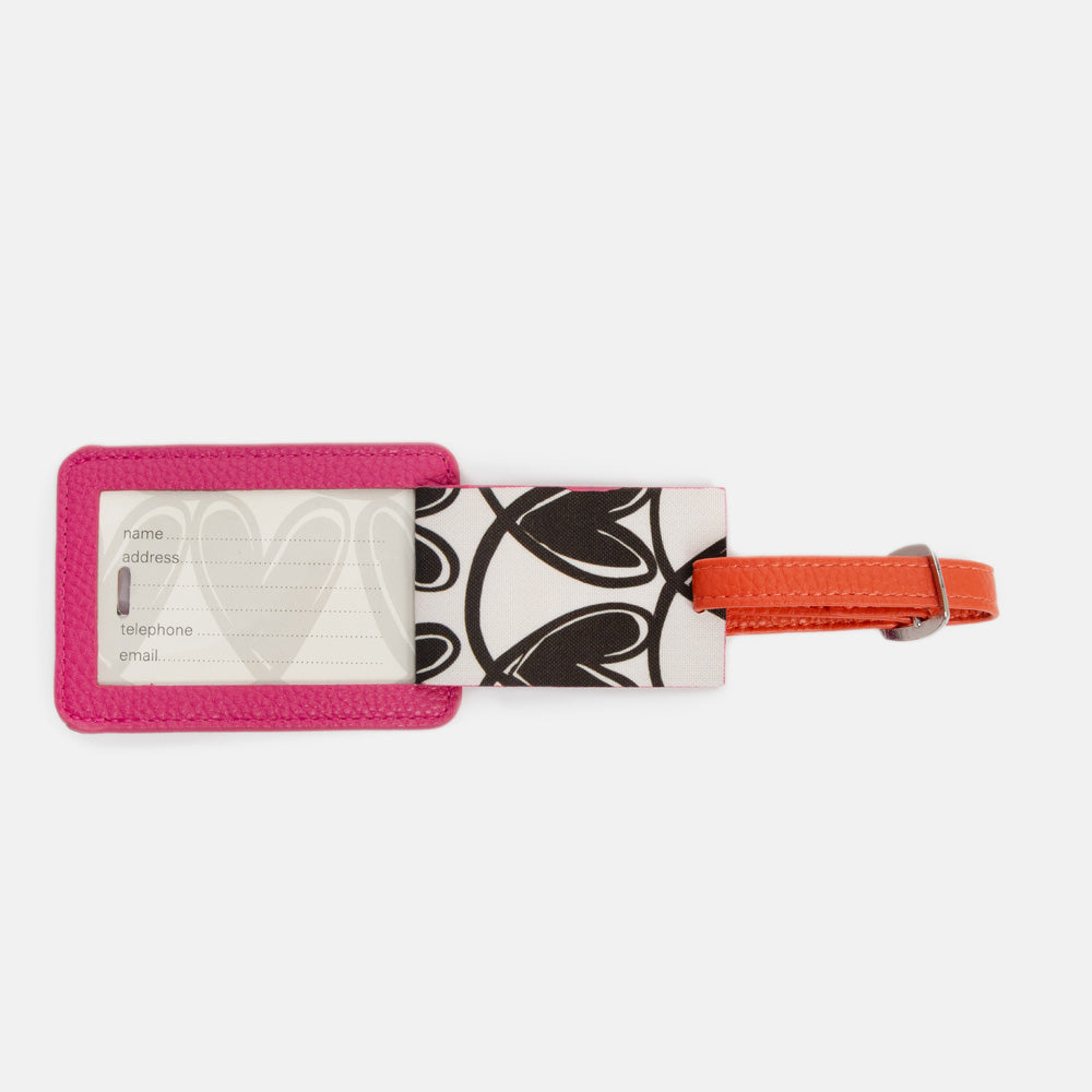 bright pink leather look luggage tag with window for name and address details