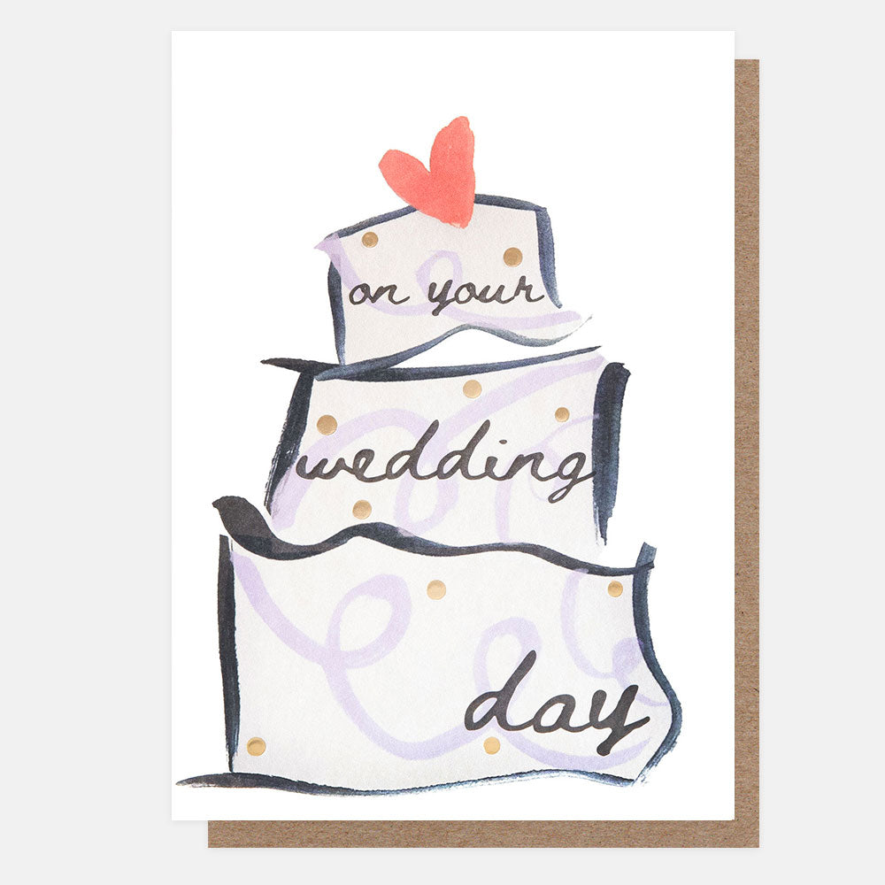 wedding card featuring a watercolour 3 tier cake with lilac swirls and gold spots and a red heart on top, with the text 'on your wedding day'