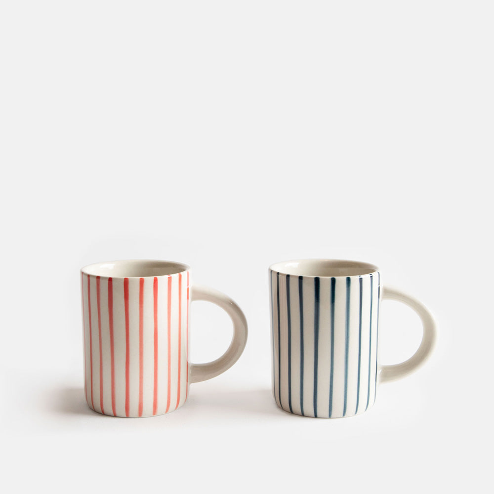 Two striped espresso coffee cups on a white background