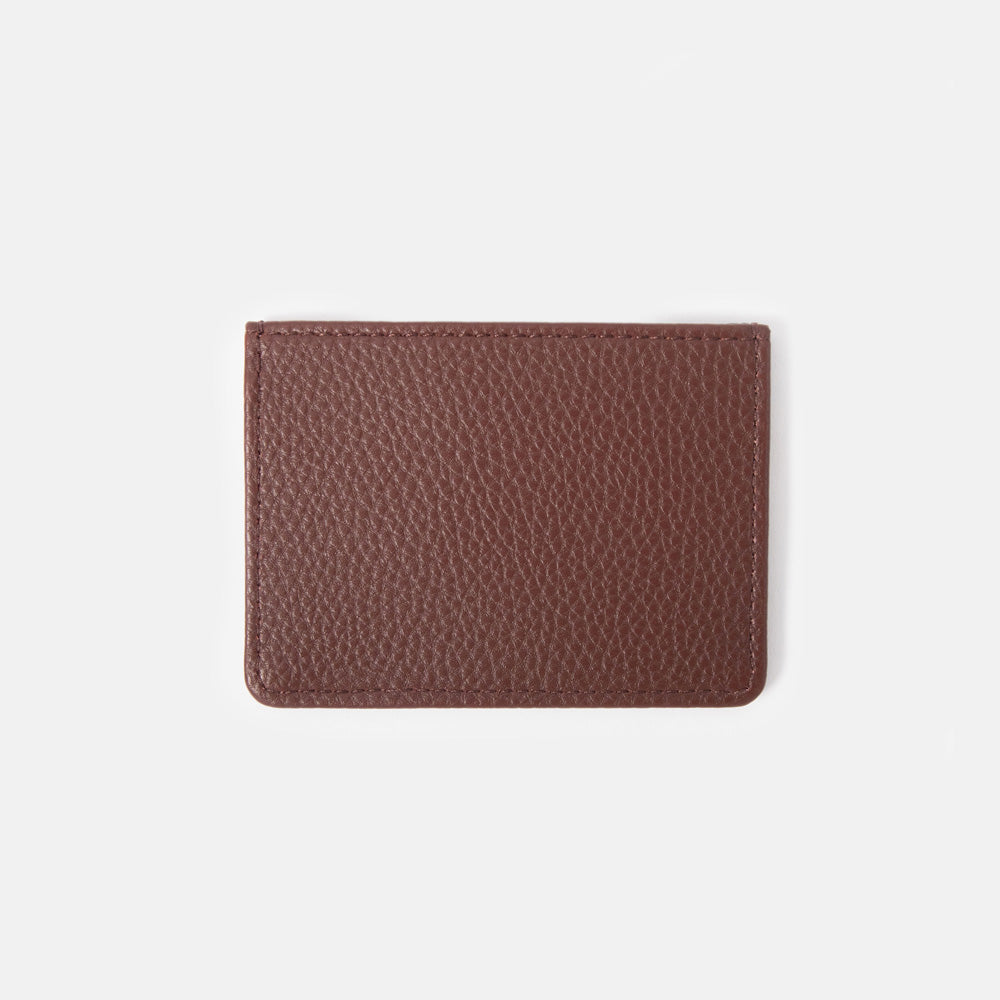 dark purple leather look card holder wallet on a white background