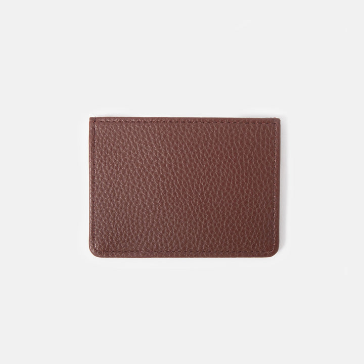 dark purple leather look card holder wallet on a white background