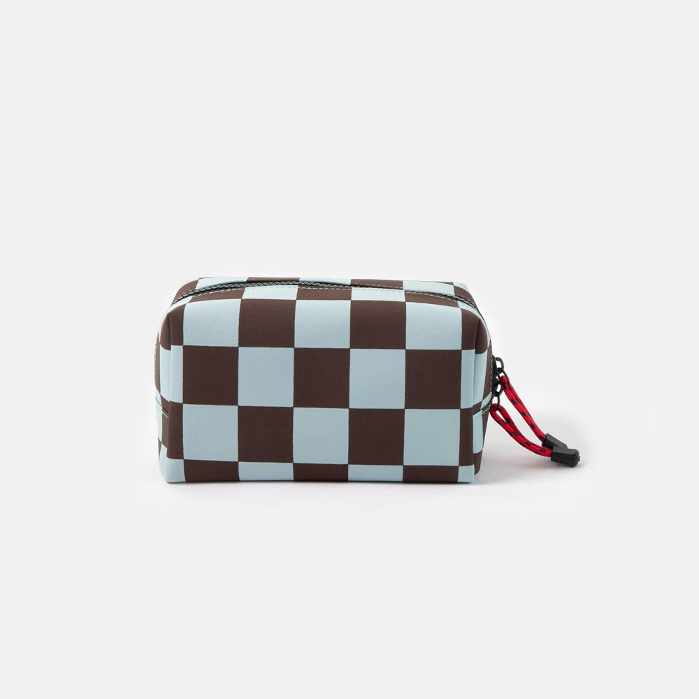 dark purple and light blue checked grooming back with red zip pulls on a white background