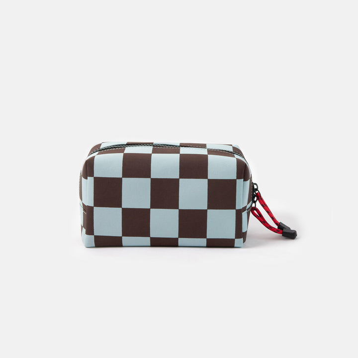dark purple and light blue checked grooming back with red zip pulls on a white background