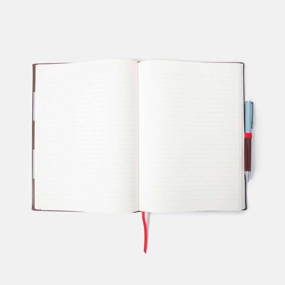 Open notebook with a pen on a white background