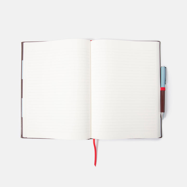 Open notebook with a pen on a white background