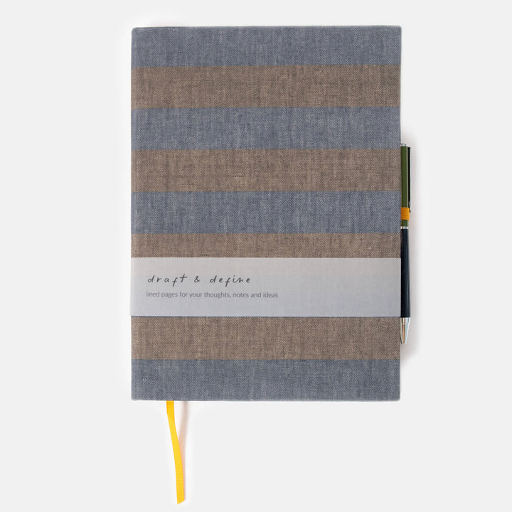 khaki and navy blue striped notebook & pen set on a white background