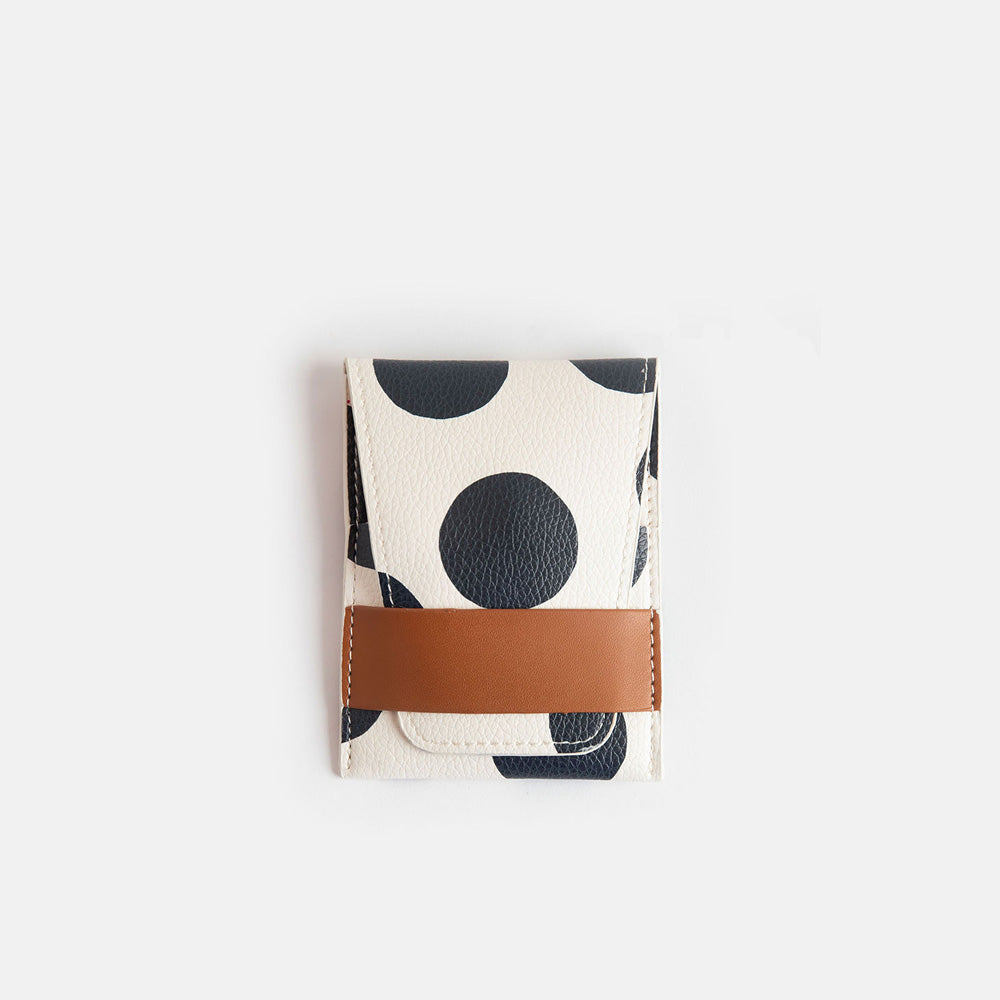 manicure set with nail file, scissors, nail clippers, cuticle clippers & cuticle tool in a spot print leather look PU holder