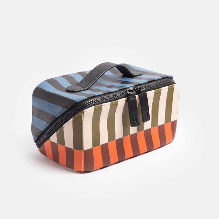 diagonal zip flat lay vegan leather wash bag in retro stripe print in orange, brown, green, white and blue