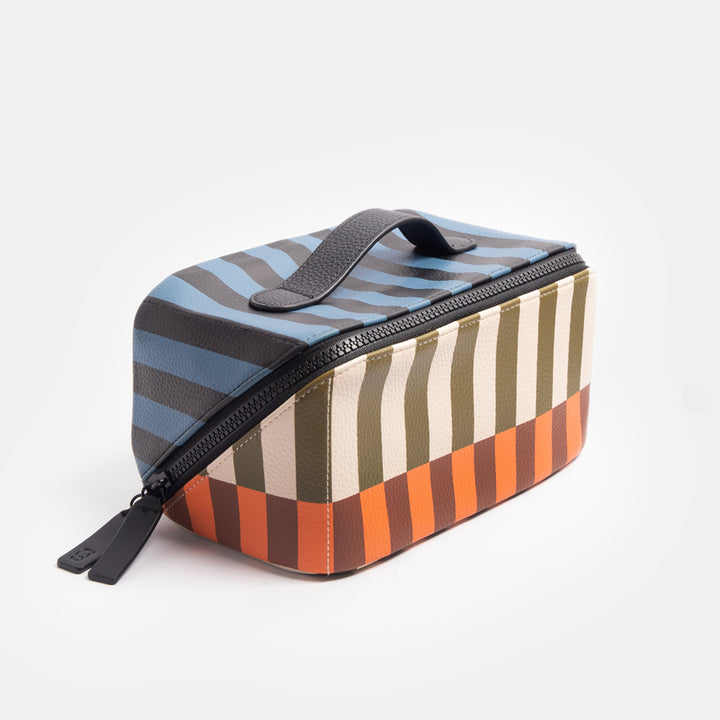 diagonal zip flat lay vegan leather wash bag in retro stripe print in orange, brown, green, white and blue