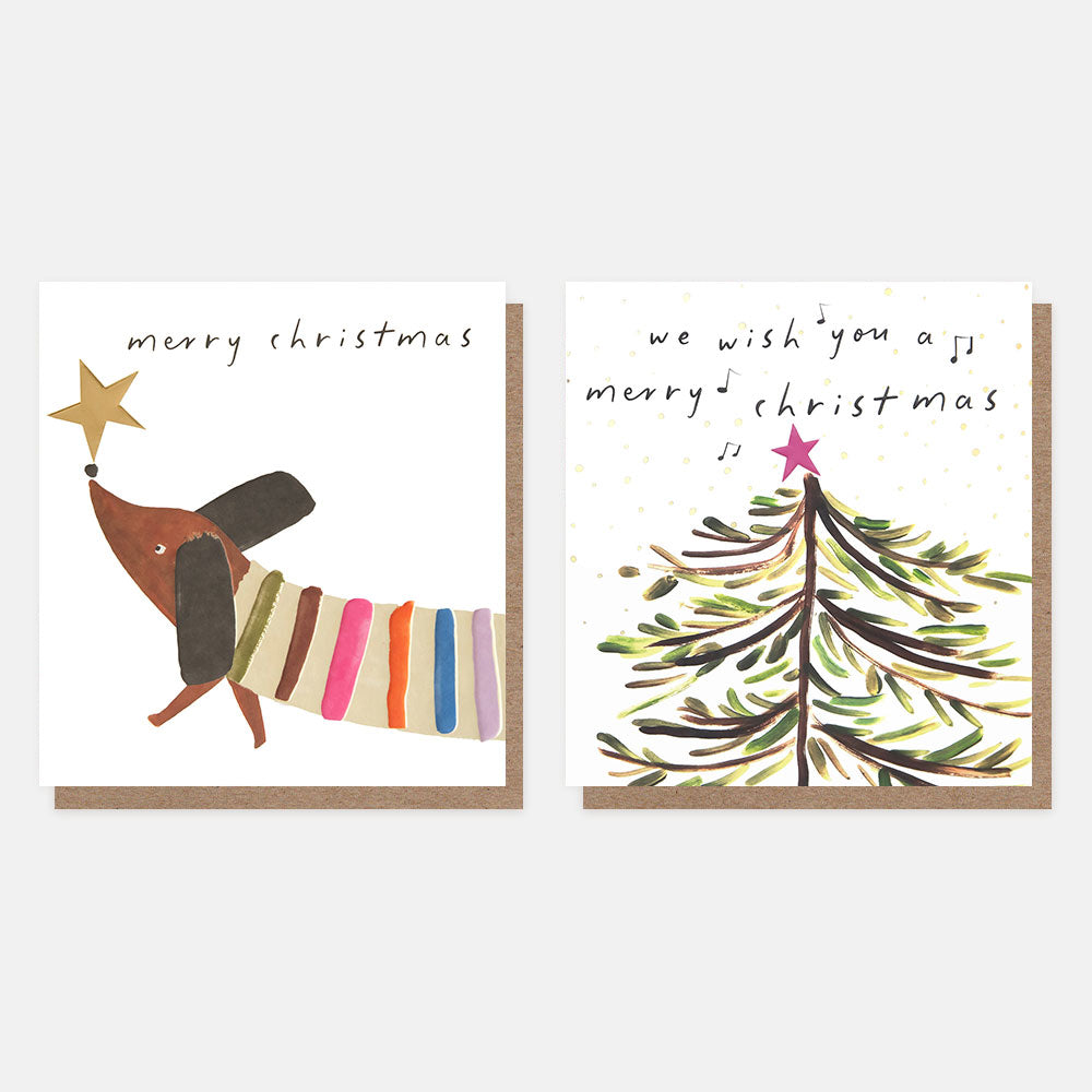 two Christmas card designs on a white background, one with a sausage dog in a stripy jumpy and a gold star on it's nose, the other with a Christmas tree and pink star