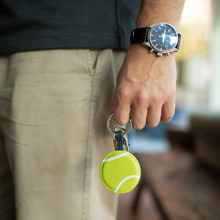 green tennis ball padded keyring with silver o ring and brown leather look tab