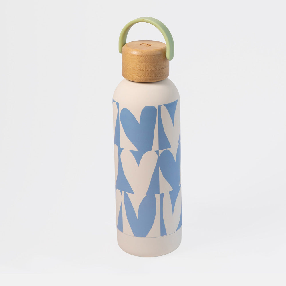 A stainless steel water bottle with a light beige body, a blue and beige hearts pattern, a light wood cap, and a light green carrying loop, shown on a light gray background.