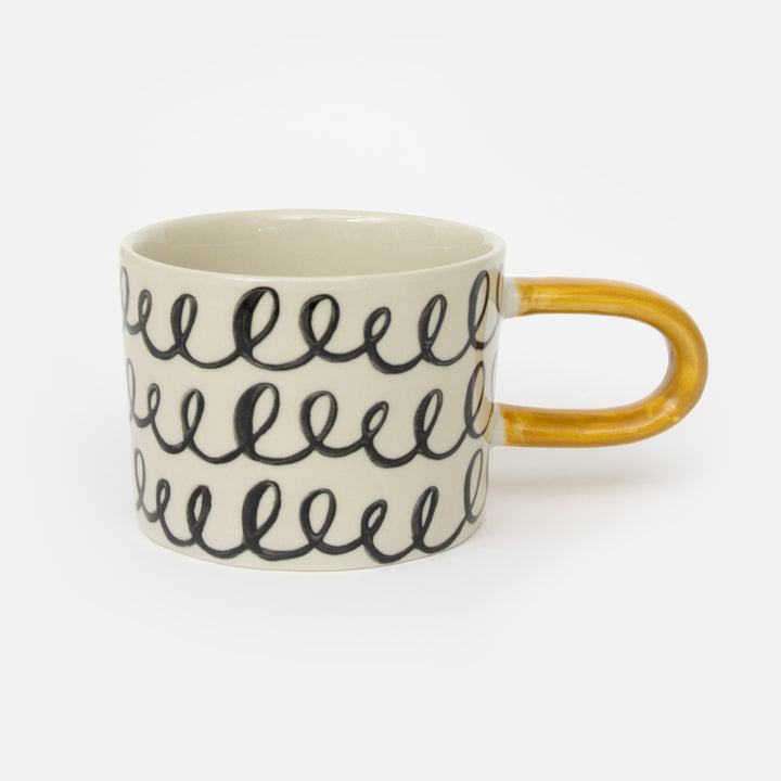 monochrome loops hand painted glazed stoneware mug with contrast mustard yellow handle