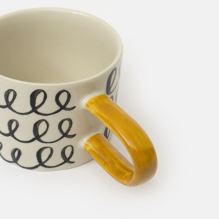 monochrome loops hand painted glazed stoneware mug with contrast mustard yellow handle