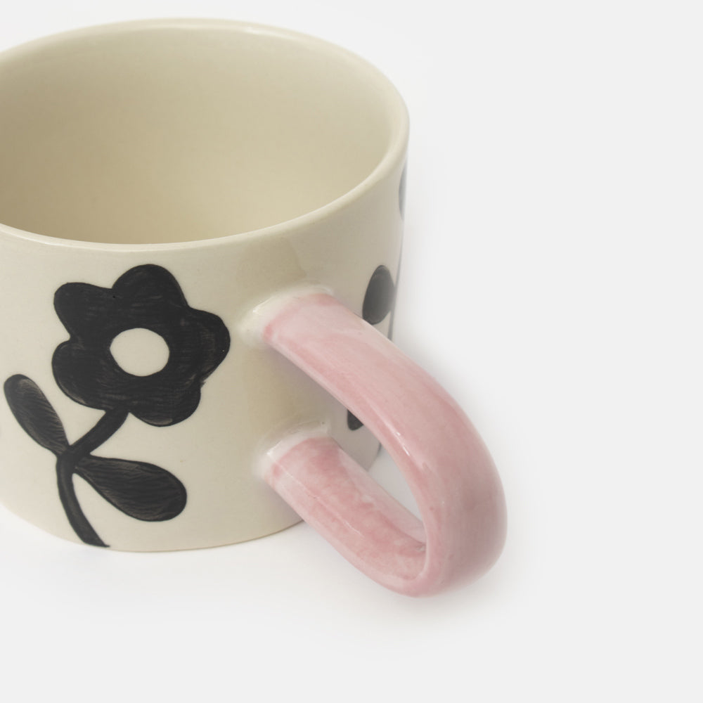 monochrome floral design hand painted glazed stoneware mug with contrast pale pink handle