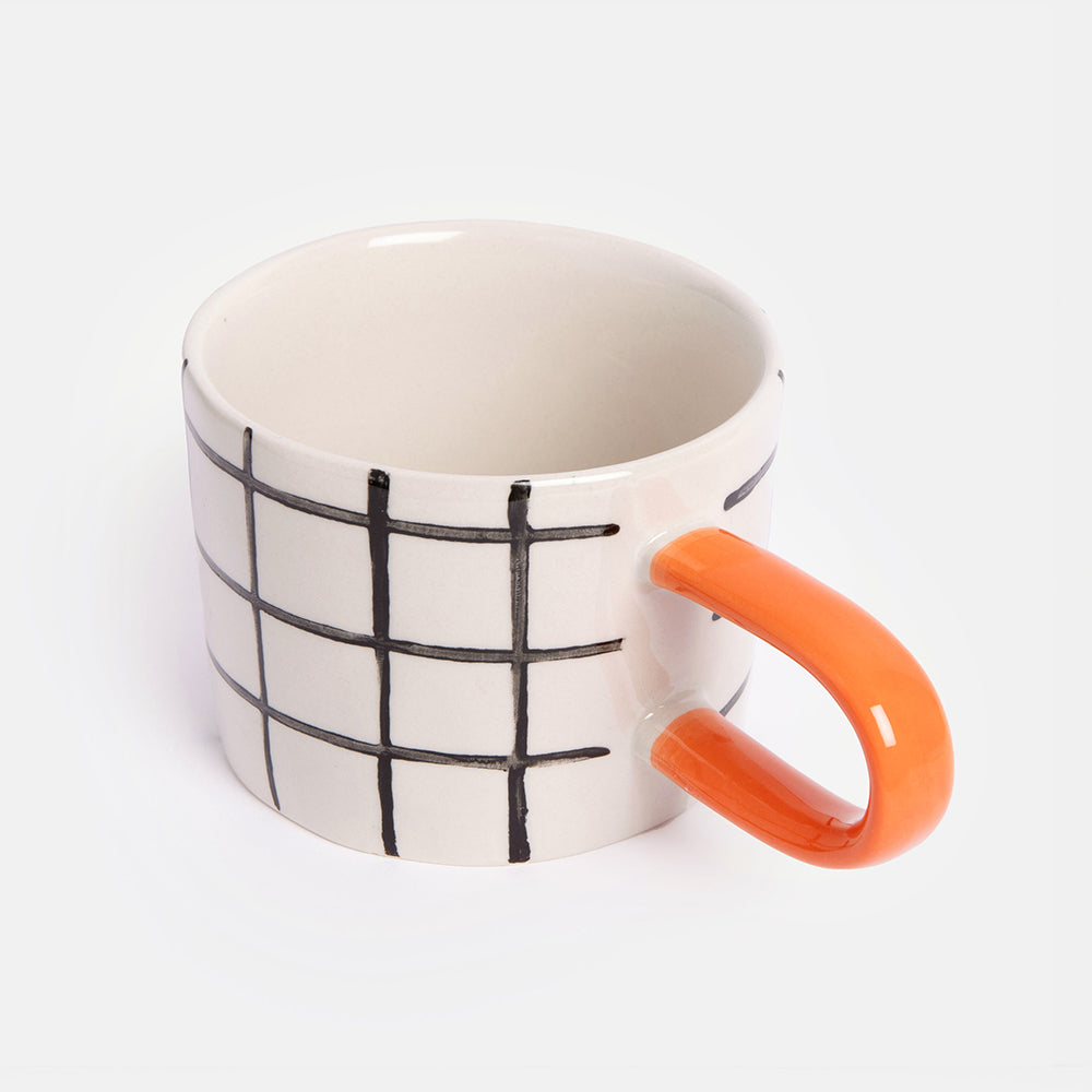 monochrome grid check stoneware ceramic mug with orange handle