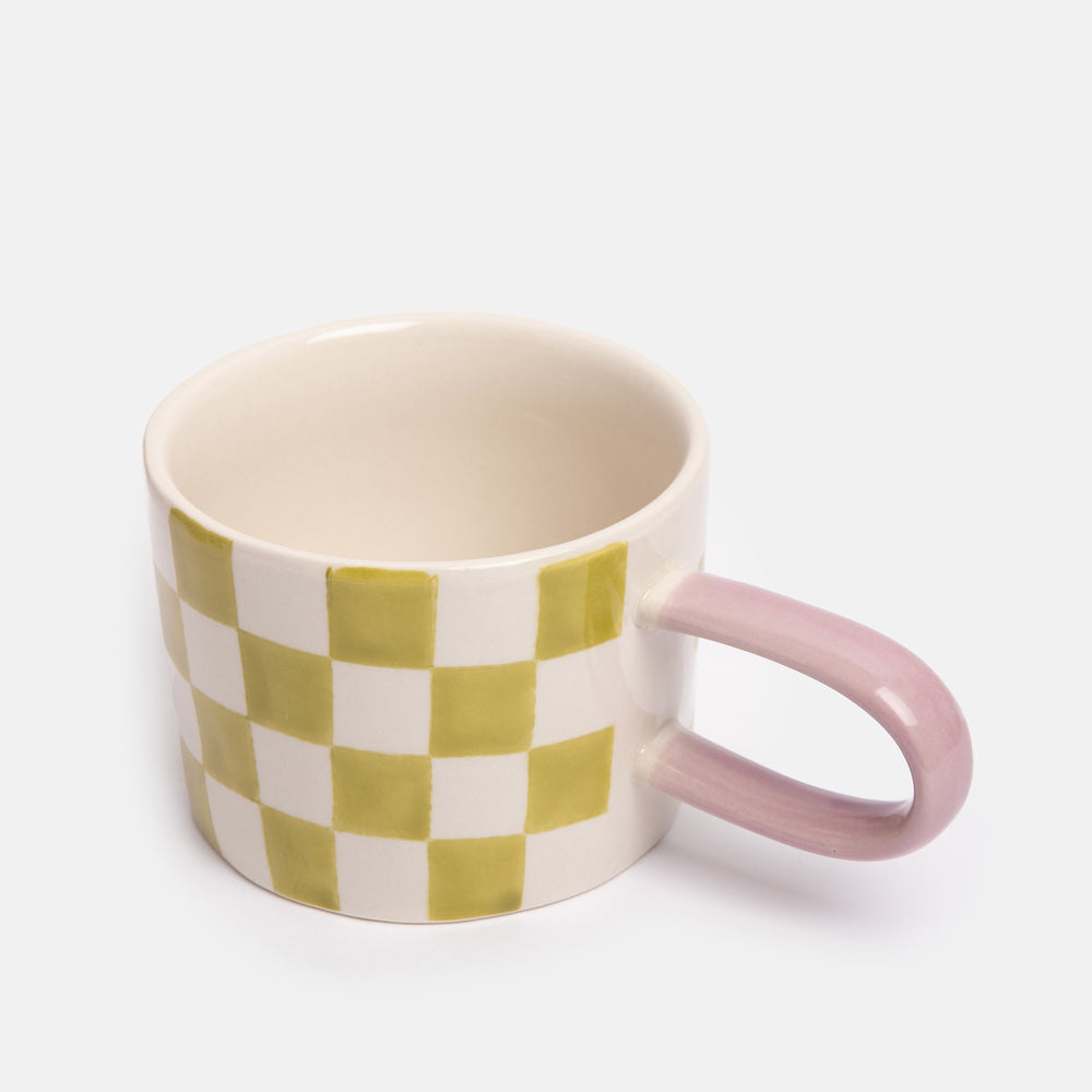 hand painted ceramic stoneware mug with green check design and pale pink elongated handle