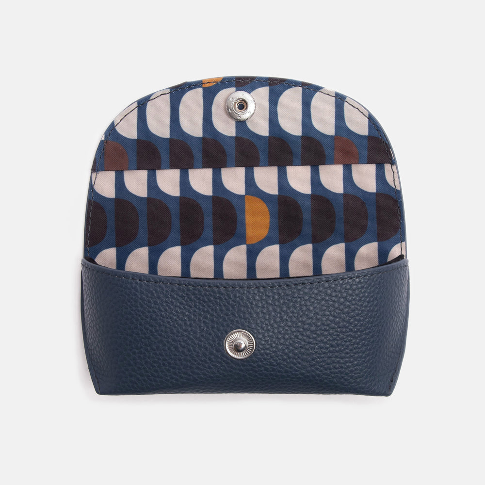 leather look overflap glasses case in navy blue with retro semi circle print lining in blue, whir and orange