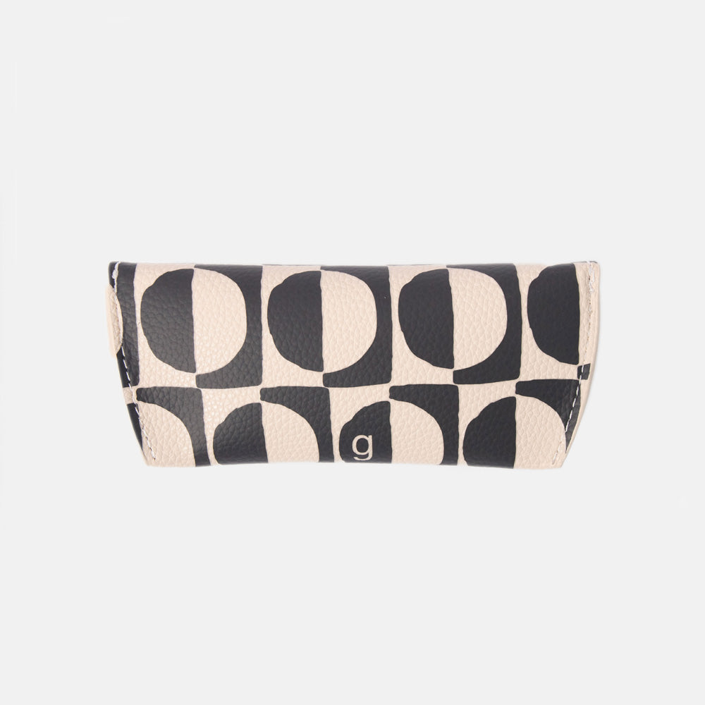 black and white geometric circles design leather look glasses case on a white background