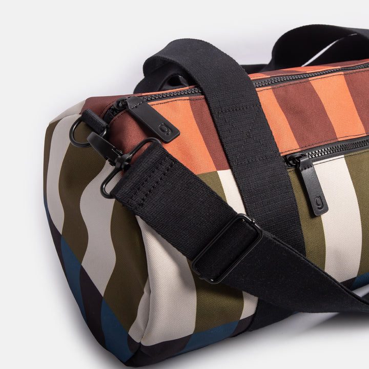 nylon barrel gym bag in retro style stripe design with adjustable shoulder strap