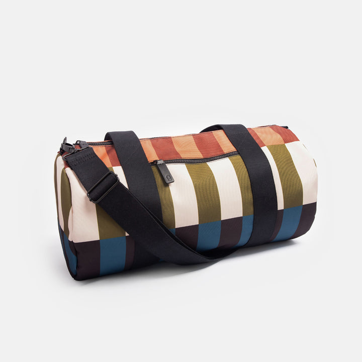 nylon barrel gym bag in retro style stripe design with adjustable shoulder strap