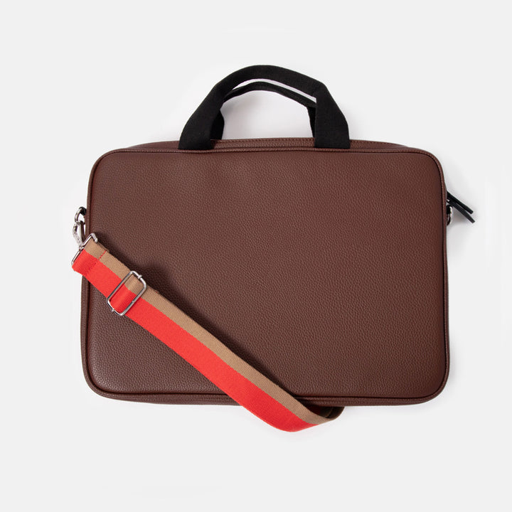 dark purple leather look laptop bag with black grab handles and red & sand stripe webbing shoulder strap