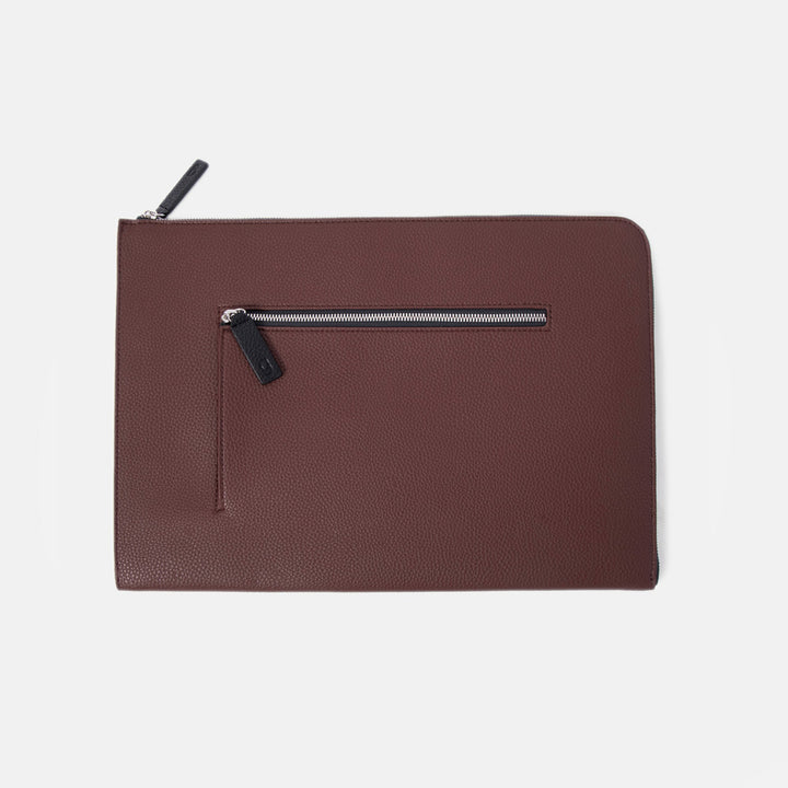 purple leather look laptop sleeve with front pocket on a white background