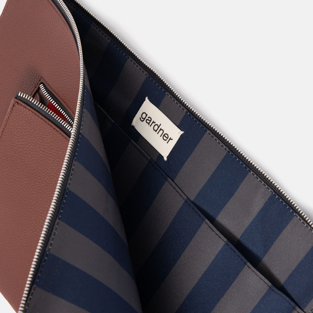 drk purple laptop sleeve with navy blue and dark khaki stripe lining and 'gardner' branded tab