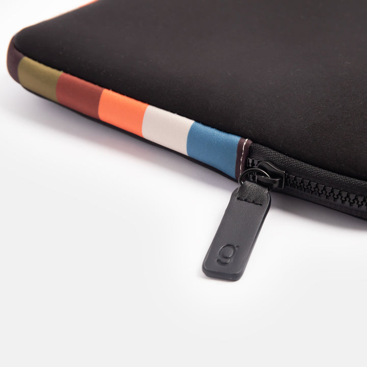 black neoprene 14 inch laptop sleeve with colourful retro stripe trim and lining