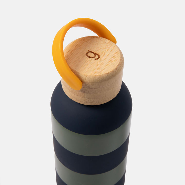 green and blue stripe metal water bottle with wooden lid and yellow carry handle on a white background