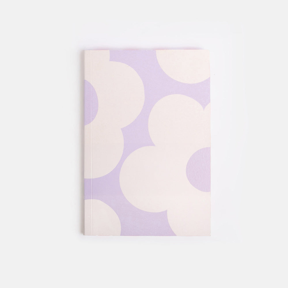 Notebook with a pattern of white flowers on a light purple background