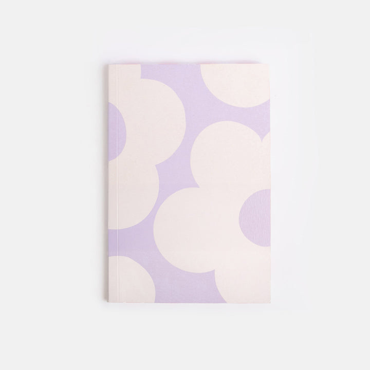 Notebook with a pattern of white flowers on a light purple background