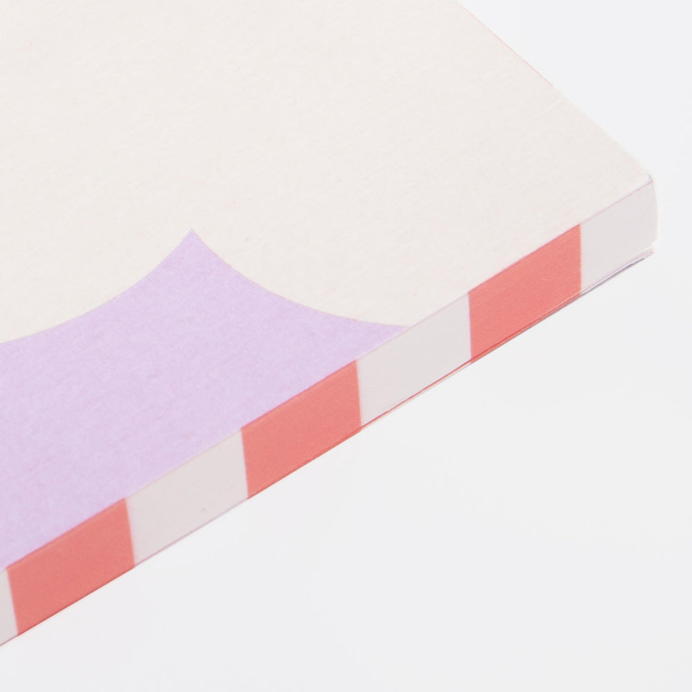 lilac notebook with orange striped page edge design